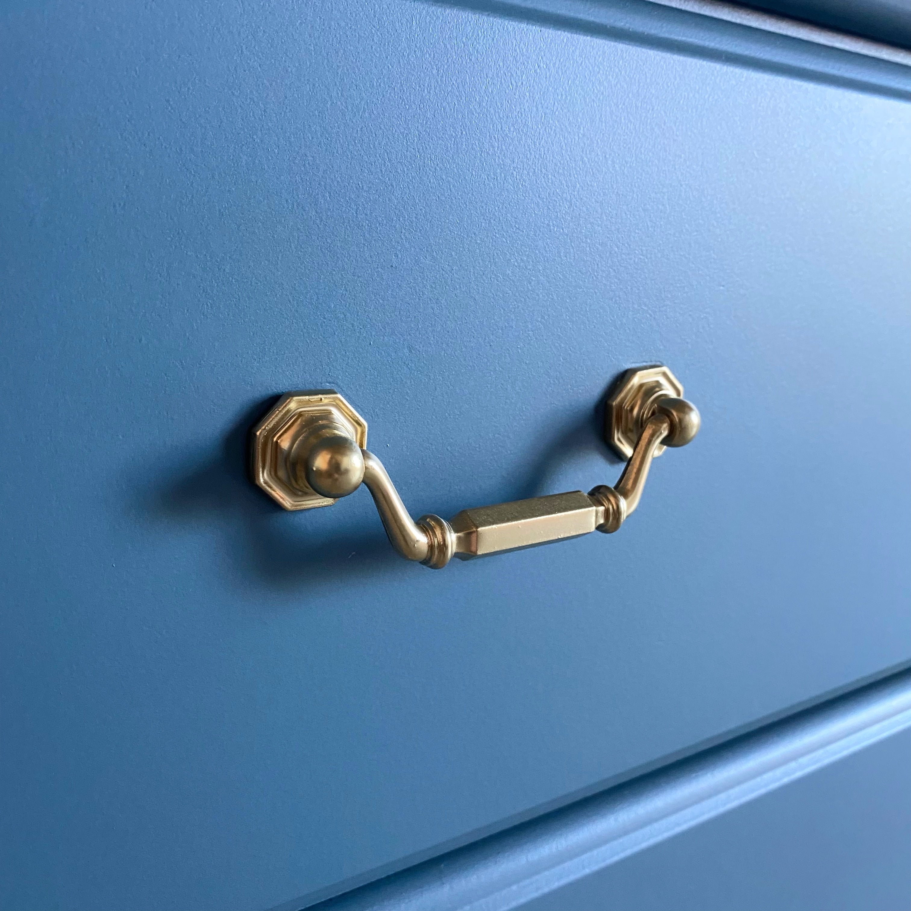 Gorgeous blue dresser with gold feature pulls