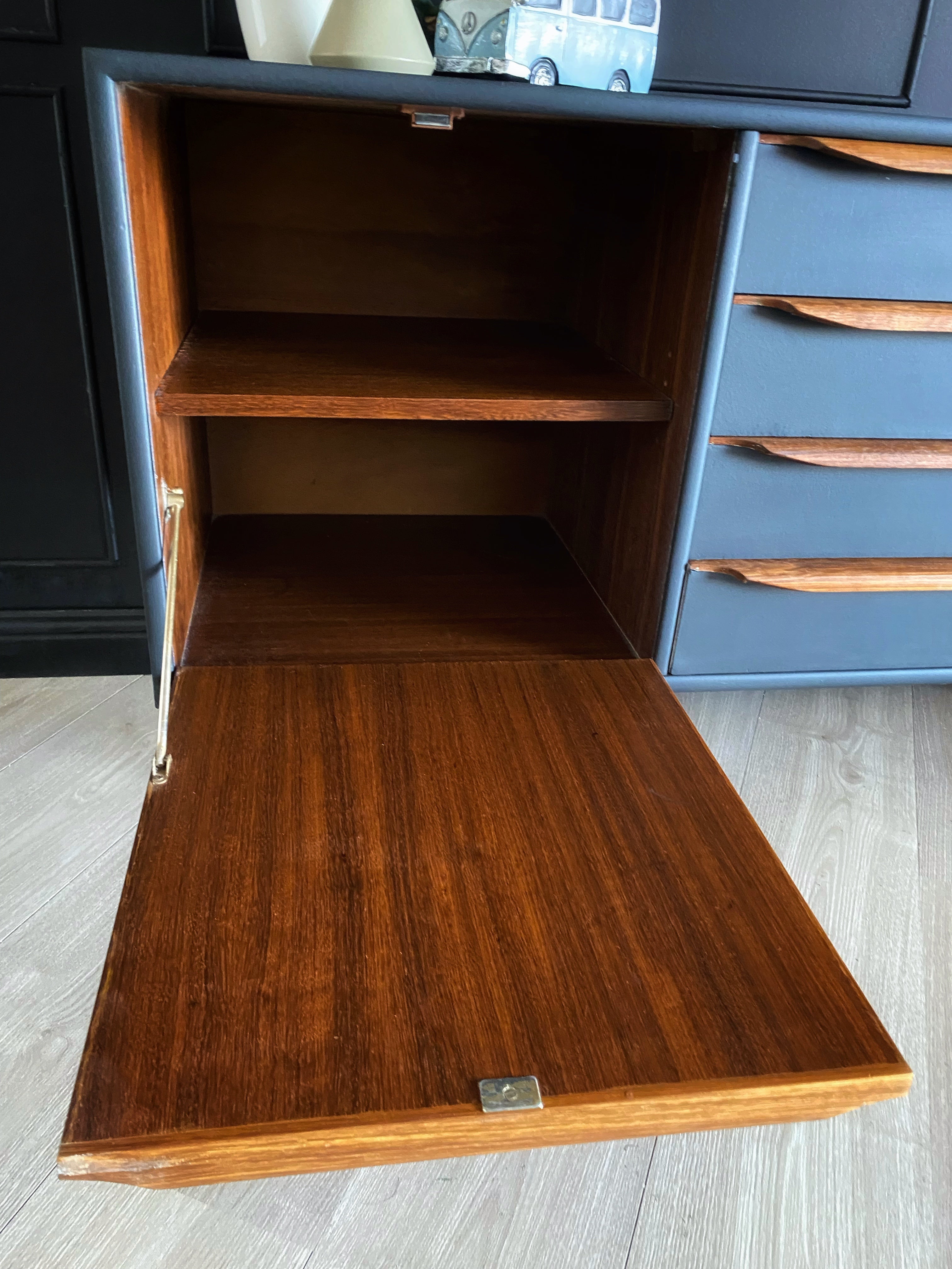 Sophisticated Black Sideboard With Wooden Handles