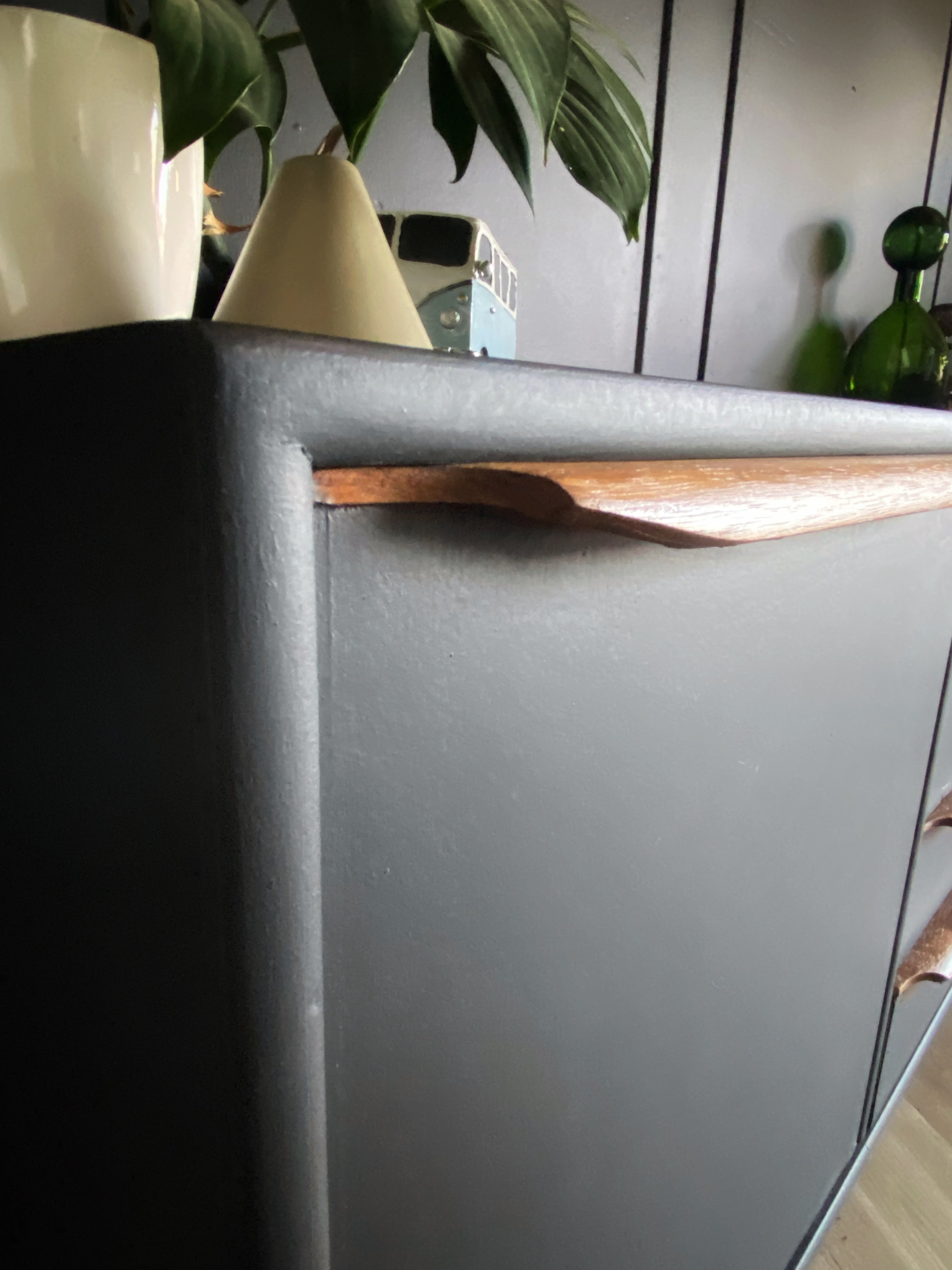 Sophisticated Black Sideboard With Wooden Handles