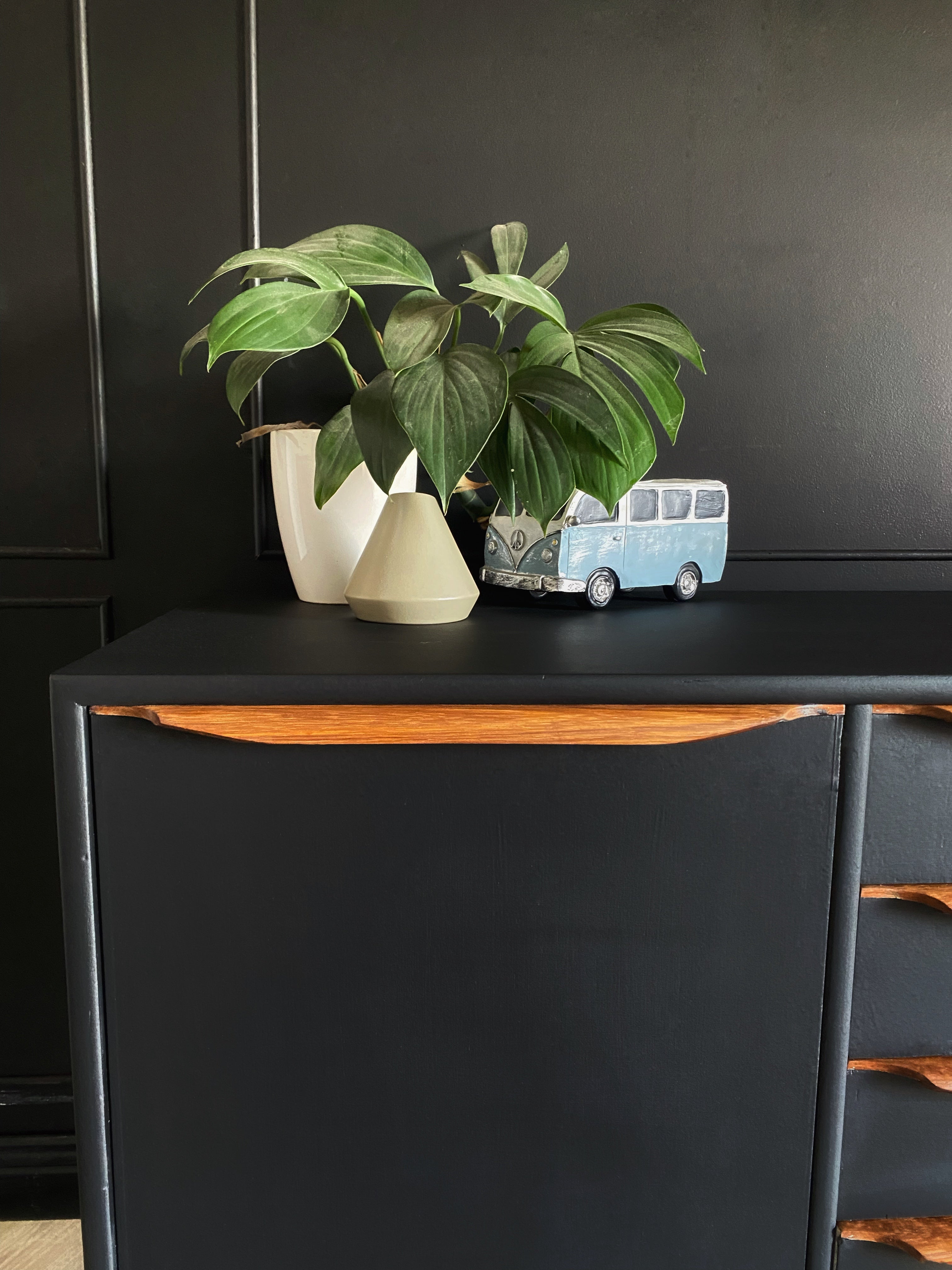 Sophisticated Black Sideboard With Wooden Handles